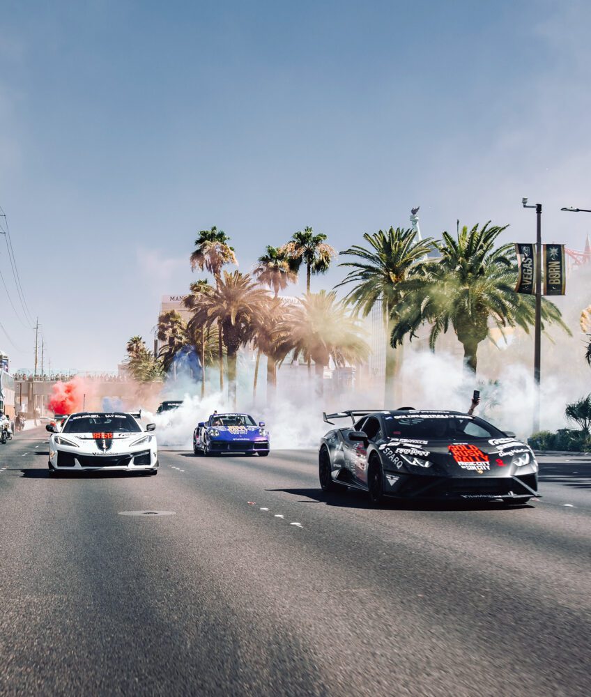 Rally participants celebrate the epic conclusion with signature colored smoke as the convoy makes its way through Las Vegas.